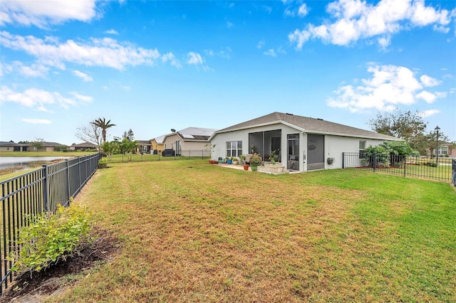 5720 107th Ter E, Parrish, FL 34219 - fenced backyard featuring a sunroom