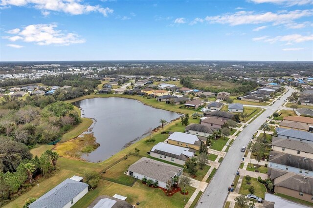 5720 107th Ter E, Parrish, FL 34219 - aerial view of property and surrounding area featuring a large body of water and nearby suburban area
