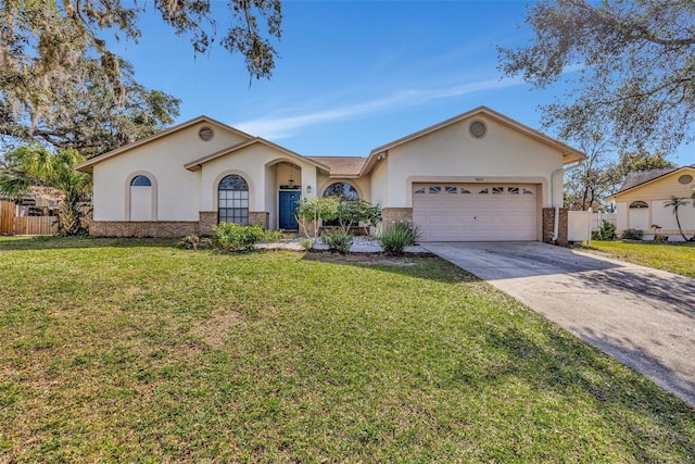 ranch-style home featuring a garage and a front lawn