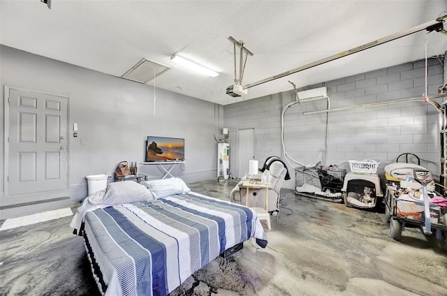 garage with a garage door opener and electric water heater