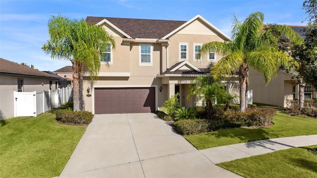 view of front of property with a garage and a front yard