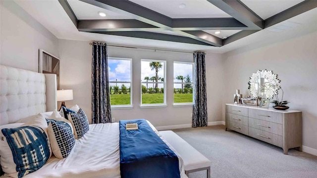 bedroom with coffered ceiling, beamed ceiling, and light colored carpet