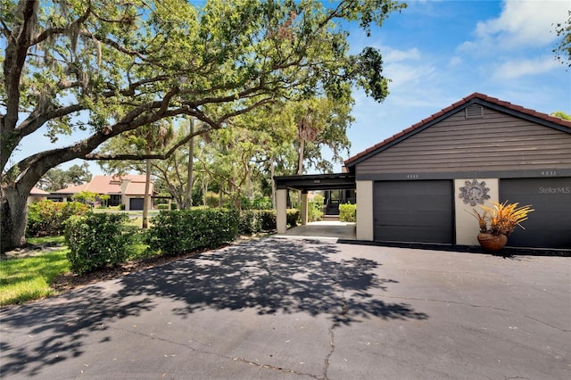 view of side of home with a carport