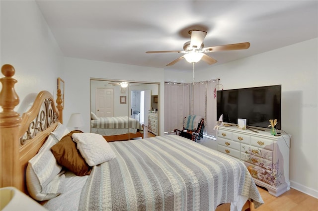 bedroom with ceiling fan and light wood-type flooring