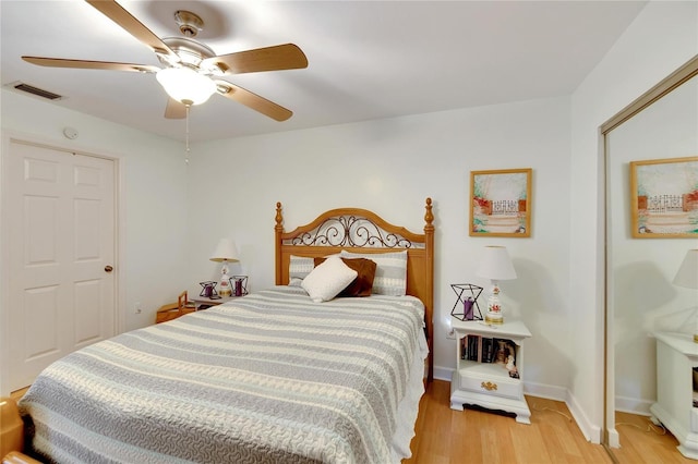 bedroom featuring ceiling fan and light hardwood / wood-style flooring