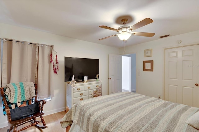 bedroom featuring ceiling fan and light hardwood / wood-style flooring