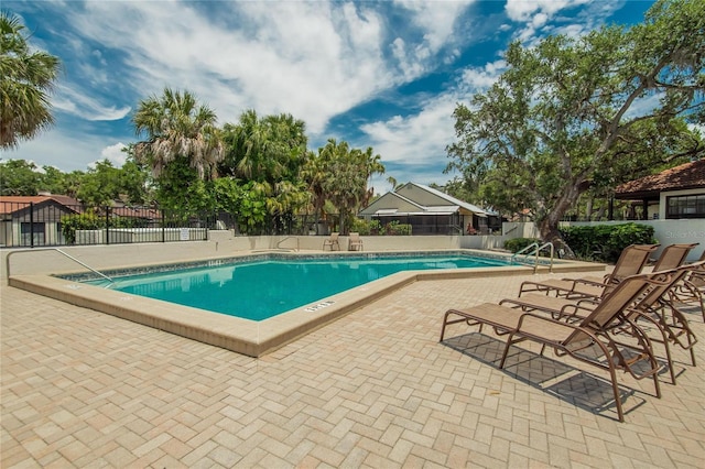 view of swimming pool featuring a patio area