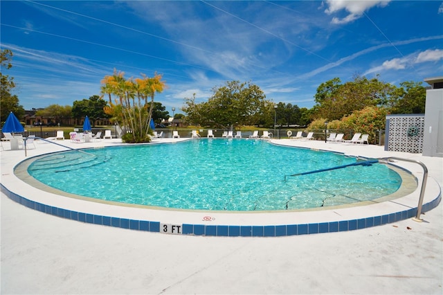 view of swimming pool featuring a patio