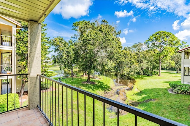 balcony featuring a water view