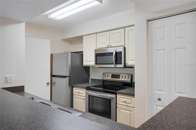 kitchen with appliances with stainless steel finishes and sink