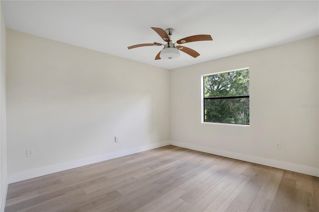 spare room with light hardwood / wood-style flooring and ceiling fan