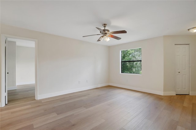 empty room featuring ceiling fan and light hardwood / wood-style floors