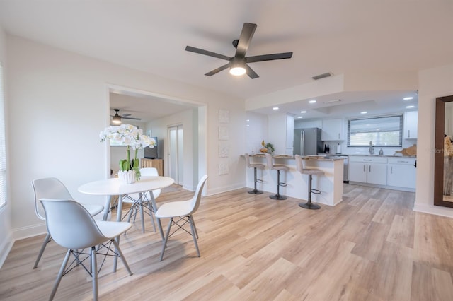 dining room featuring light hardwood / wood-style floors and sink