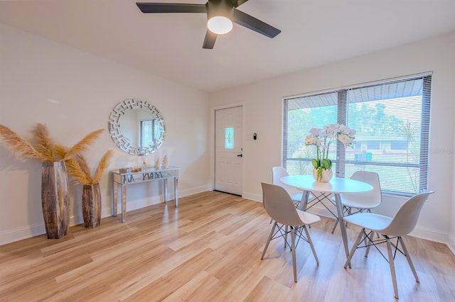 dining space with ceiling fan, a healthy amount of sunlight, and light hardwood / wood-style floors