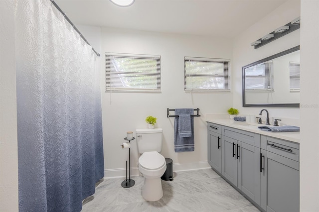 bathroom with toilet and vanity