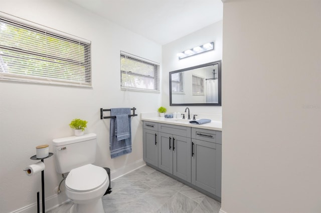 bathroom featuring toilet and vanity