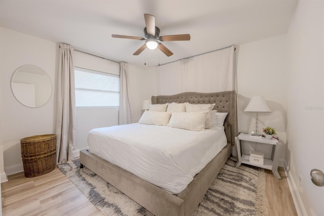 bedroom with ceiling fan and light hardwood / wood-style floors