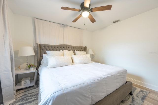 bedroom featuring light hardwood / wood-style flooring and ceiling fan