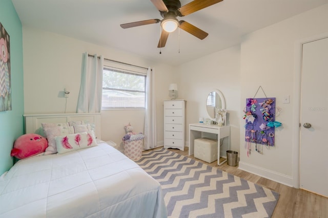 bedroom featuring ceiling fan and light hardwood / wood-style flooring