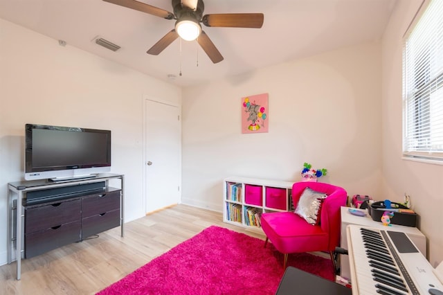 bedroom featuring light hardwood / wood-style flooring and ceiling fan