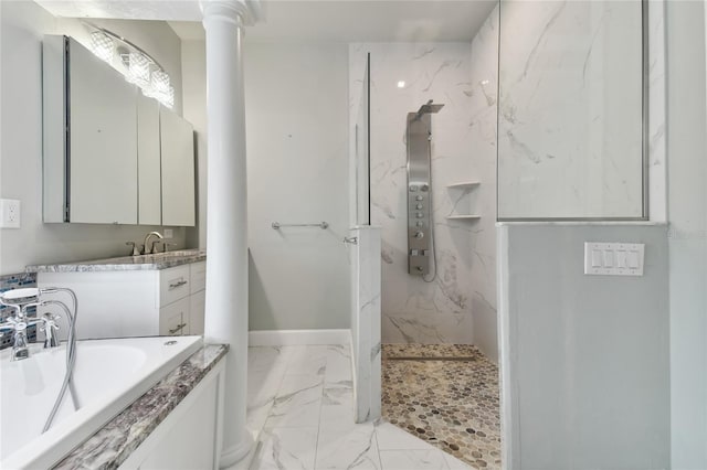 bathroom with decorative columns, vanity, and plus walk in shower