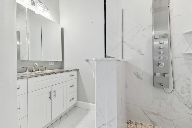 bathroom with vanity and a tile shower