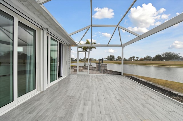 deck with a water view and a lanai