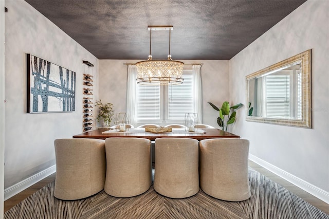 dining space featuring a notable chandelier and hardwood / wood-style floors