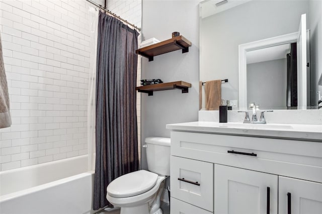 full bathroom featuring vanity, shower / bath combination with curtain, and toilet