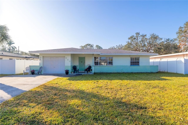 single story home with a garage and a front yard