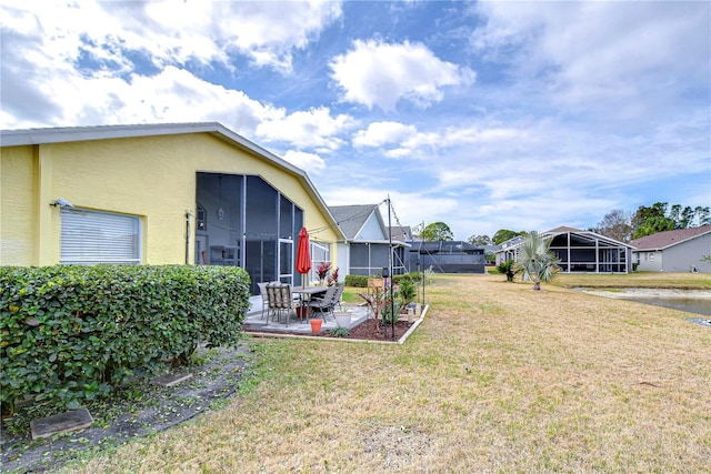 view of yard with a patio and a sunroom