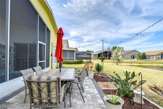 view of patio featuring a sunroom