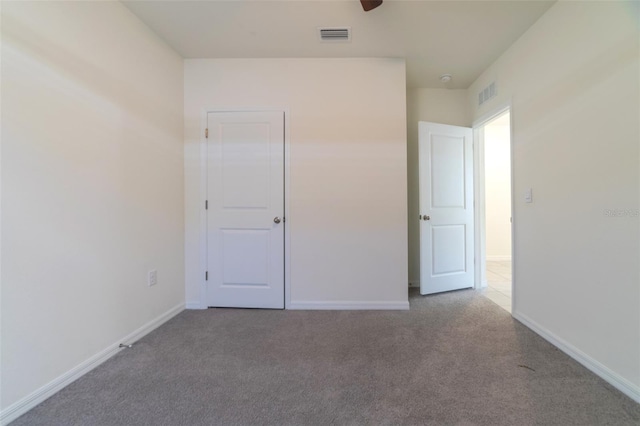 unfurnished bedroom featuring carpet