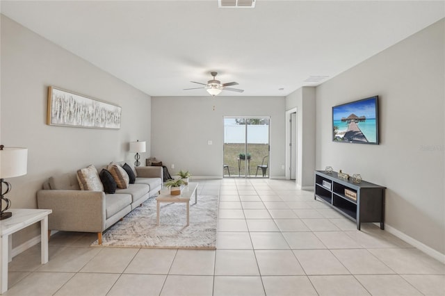 tiled living room featuring ceiling fan