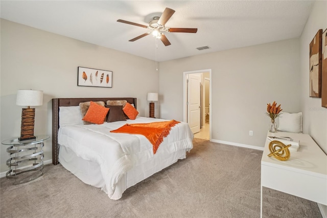 bedroom featuring ceiling fan and carpet