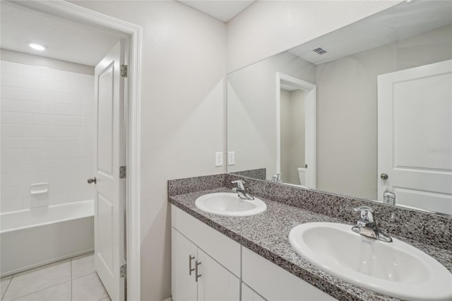 full bathroom with vanity, toilet, bathtub / shower combination, and tile patterned floors