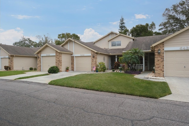 view of front of home featuring a garage and a front yard