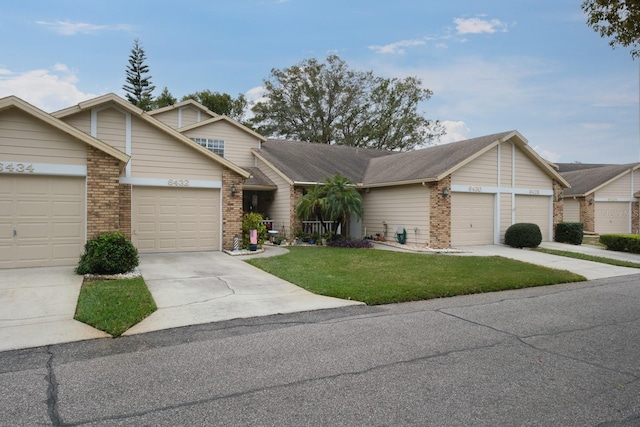 view of front of property with a garage and a front yard