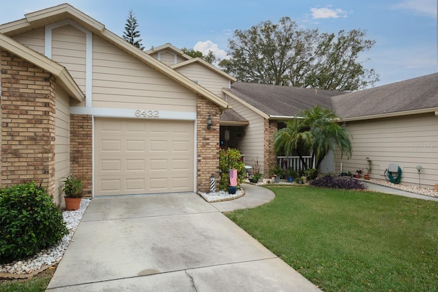 view of front facade with a garage and a front yard