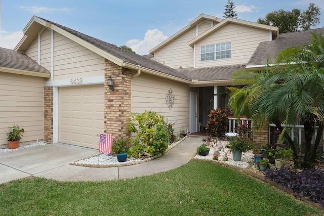 view of front of home featuring a garage and a front lawn