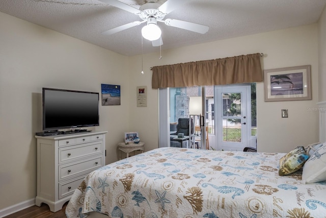 bedroom with ceiling fan, a textured ceiling, and wood-type flooring