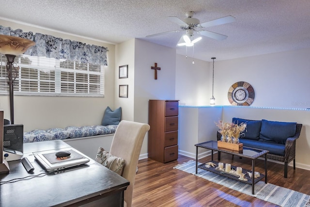 office area featuring ceiling fan, dark hardwood / wood-style flooring, and a textured ceiling