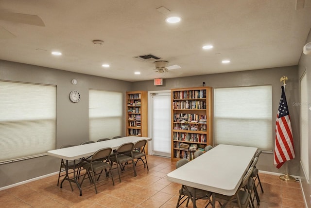 dining room with ceiling fan, light tile patterned floors, and a healthy amount of sunlight