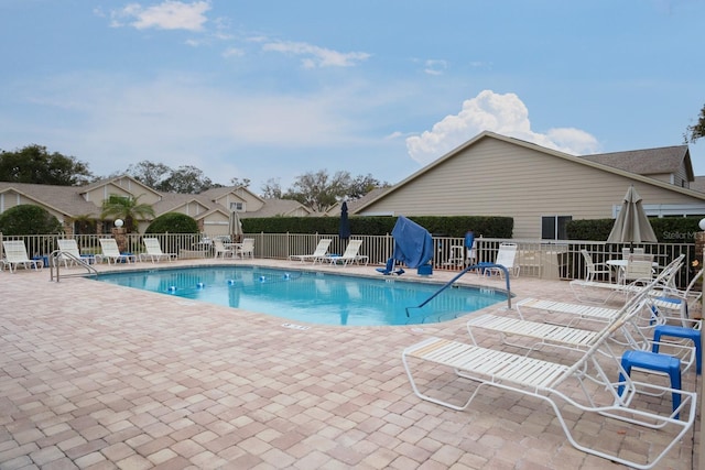 view of swimming pool with a patio