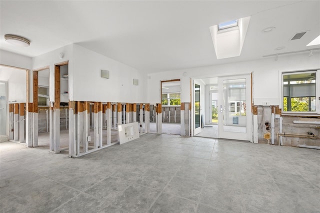 spare room with a skylight