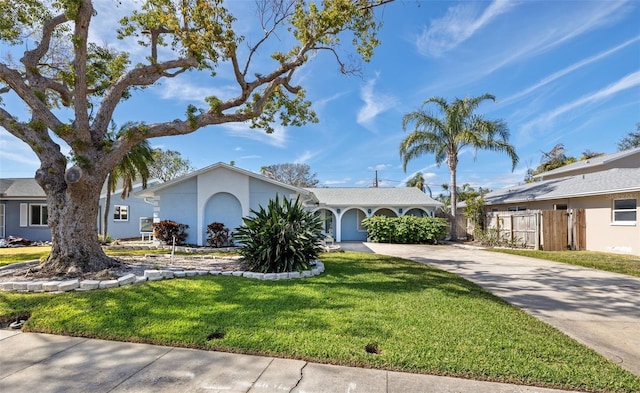 single story home with a front yard