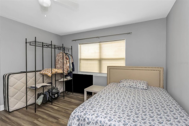 bedroom featuring ceiling fan and hardwood / wood-style floors