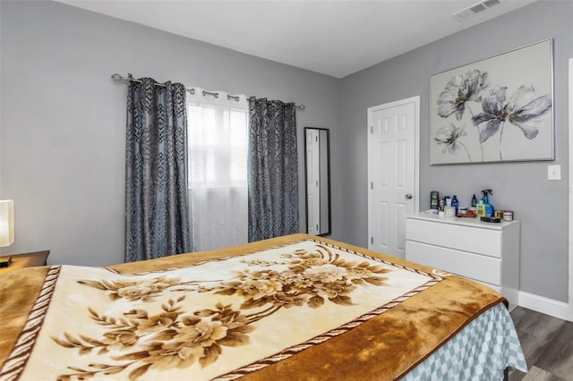 bedroom featuring dark hardwood / wood-style floors