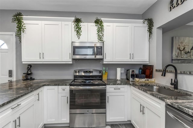 kitchen with sink, white cabinetry, and appliances with stainless steel finishes