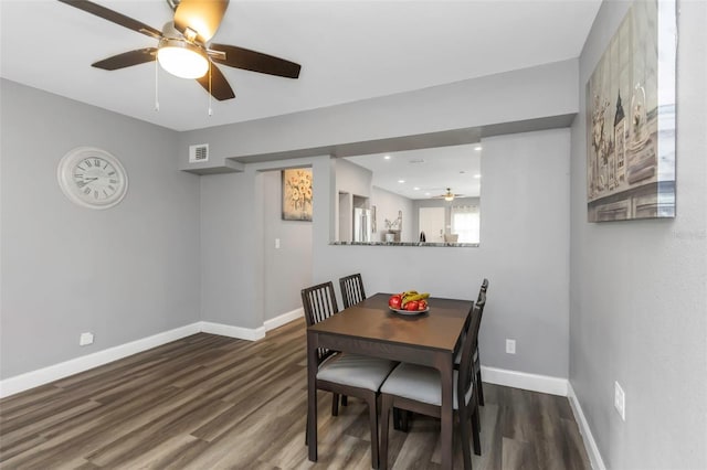 dining area featuring hardwood / wood-style flooring and ceiling fan